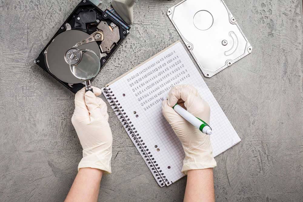 Concept of data recovery, engineer is recovering data from failed hard disk driver